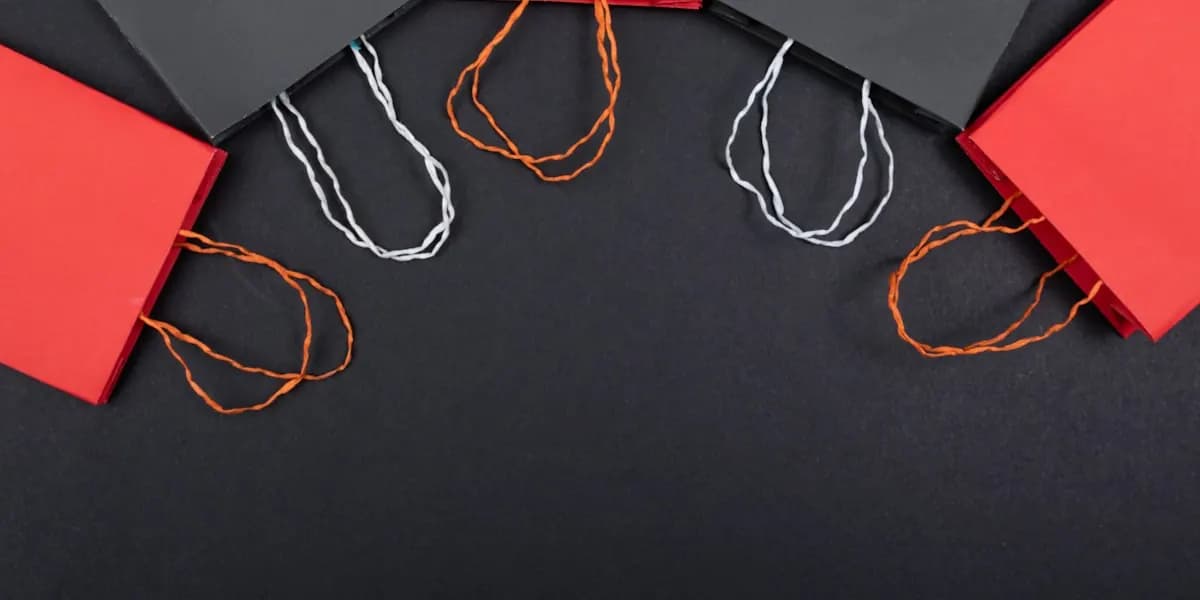 Red and black shopping bags on a dark background